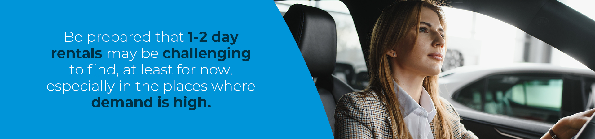 female business traveller driving a car 