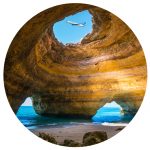 Business Travel News - November - view of plane through rock formation