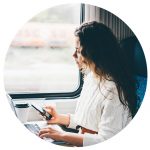 Passenger using phone on train