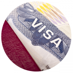 A close-up of a visa document and passport